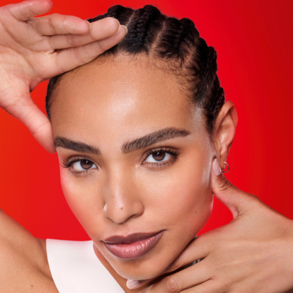 Woman resting her fingers on her face