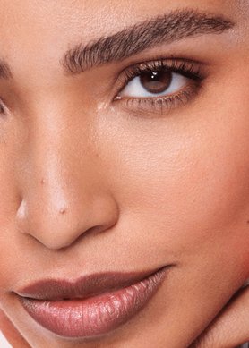 Woman resting her fingers on her face