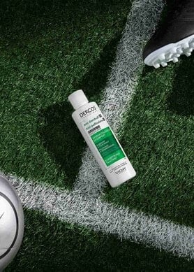 Vichy Dercos on a football field, to help stay flake-free post-workout
